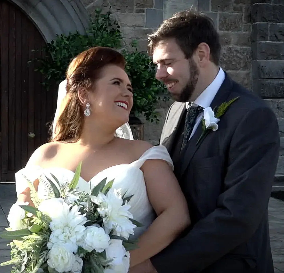 Bride and groom looking at each other